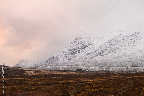 misty morning in the snow mountains of glencoe scotland