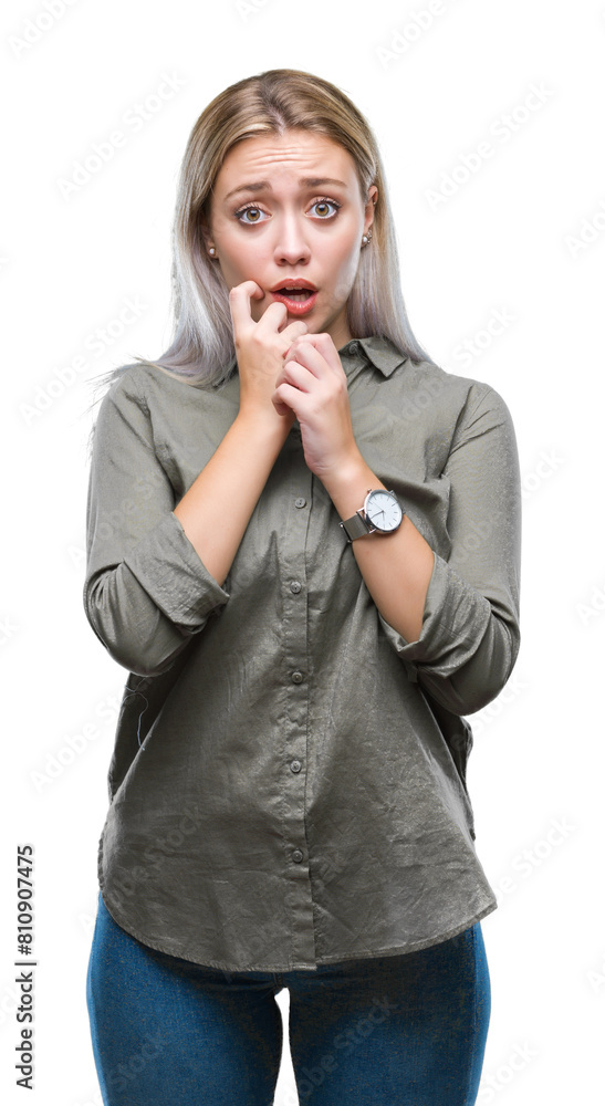 Young blonde business woman over isolated background looking stressed and nervous with hands on mouth biting nails. Anxiety problem. Young blonde business woman over isolated background looking stressed and nervous with hands on mouth biting nails. Anxiety problem.