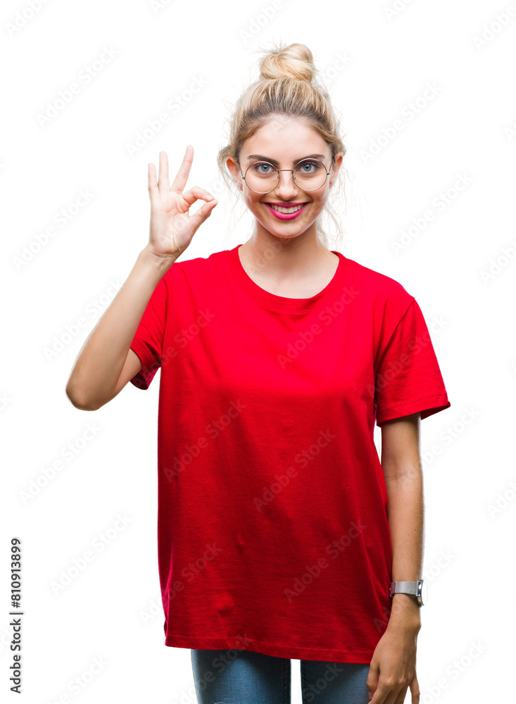Young beautiful blonde woman wearing red t-shirt and glasses over isolated background smiling positive doing ok sign with hand and fingers. Successful expression. Young beautiful blonde woman wearing red t-shirt and glasses over isolated background smiling positive doing ok sign with hand and fingers. Successful expression.