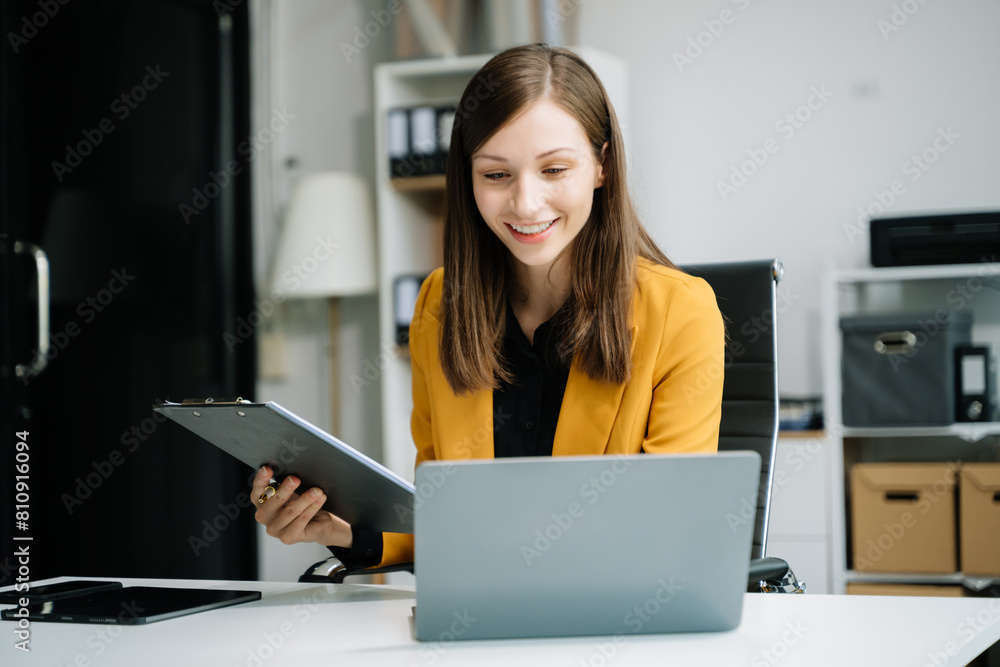 Business woman using tablet and laptop for doing math finance on an office desk, tax Business woman using tablet and laptop for doing math finance on an office desk, tax