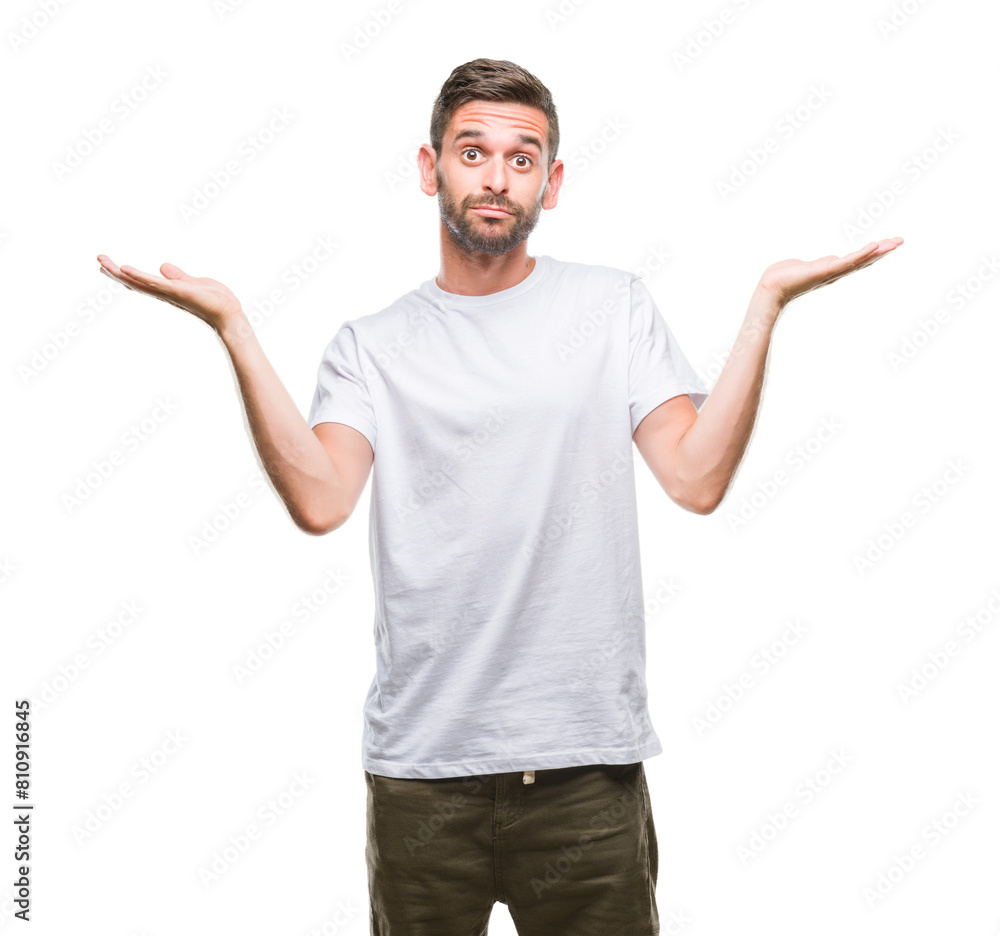 Young handsome man over isolated background clueless and confused expression with arms and hands raised. Doubt concept. Young handsome man over isolated background clueless and confused expression with arms and hands raised. Doubt concept.