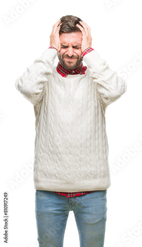 Young handsome man wearing winter sweater over isolated background suffering from headache desperate and stressed because pain and migraine. Hands on head. © Krakenimages.com