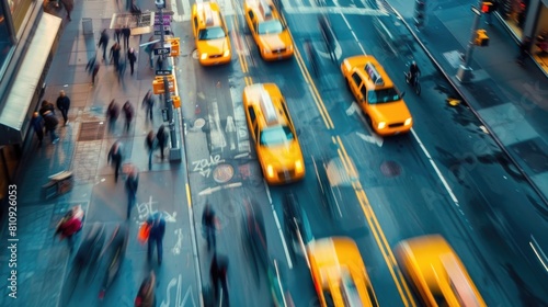 A busy city street with many people and yellow taxis. Concept of hustle and bustle, with people walking and cars driving in a busy urban environment