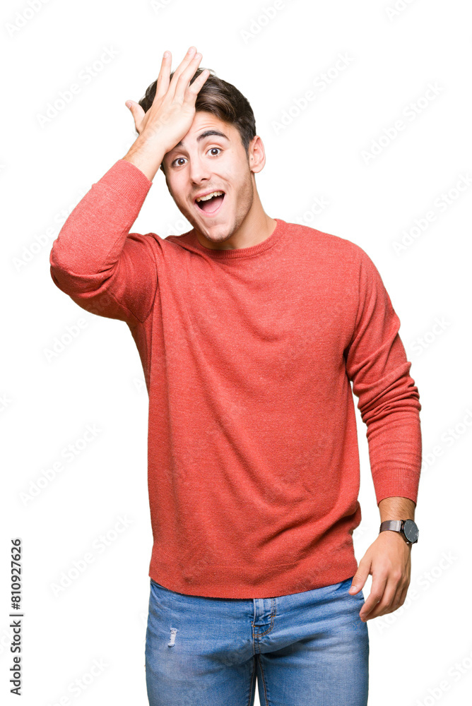 Young handsome man over isolated background surprised with hand on head for mistake, remember error. Forgot, bad memory concept.