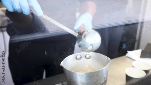 Chai Tea Masala Chai slow motion pouring in saucepan authentic asian