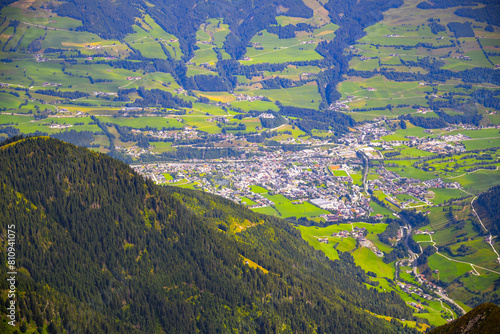 Overlooking the green landscape of Mittersill town nestled in Austrian alpine Salzach Valley, surrounded by mountains. Austrua photo