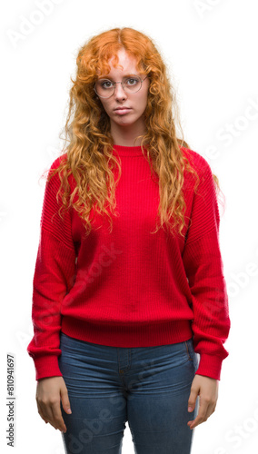 Young redhead woman wearing red sweater depressed and worry for distress, crying angry and afraid. Sad expression. © Krakenimages.com