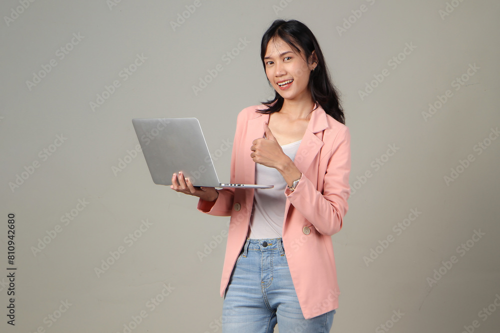 happy asian woman wearing formal casual outfit holding laptop camputer giving thumb up on isolated background happy asian woman wearing formal casual outfit holding laptop camputer giving thumb up on isolated background