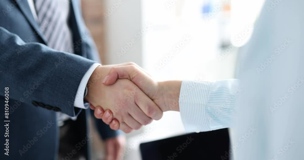 Closeup of business partners shaking hands in office 4k movie slow motion. Successful business deal concept Closeup of business partners shaking hands in office 4k movie slow motion. Successful business deal concept