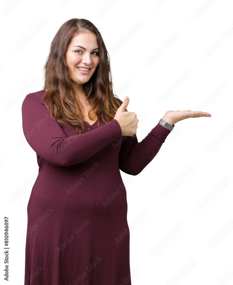 Beautiful and attractive plus size young woman wearing a dress over isolated background Showing palm hand and doing ok gesture with thumbs up, smiling happy and cheerful