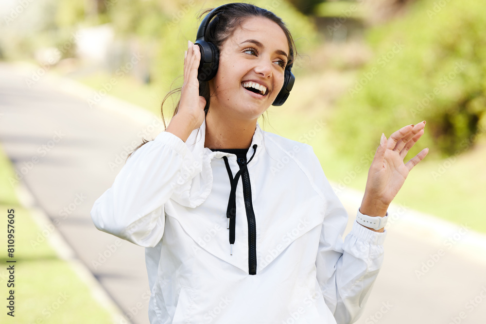 Woman, headphones and runner with smile for fitness in outdoors with entertainment, wellness and health. Exercise, podcast and laugh with streaming on weekend with audio for relax with music in park Woman, headphones and runner with smile for fitness in outdoors with entertainment, wellness and health. Exercise, podcast and laugh with streaming on weekend with audio for relax with music in park