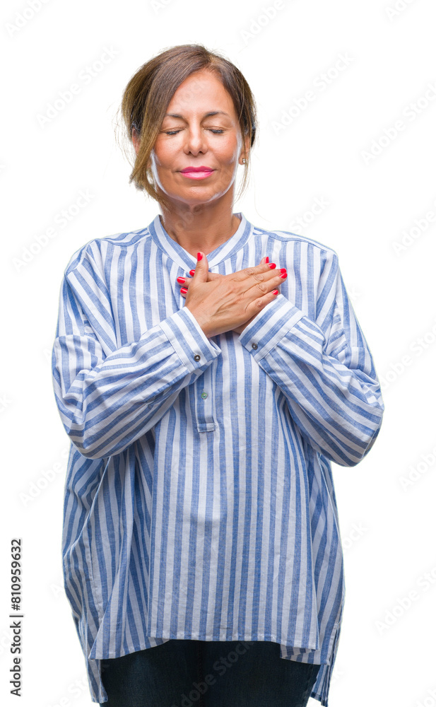 Middle age senior hispanic woman over isolated background smiling with hands on chest with closed eyes and grateful gesture on face. Health concept. Middle age senior hispanic woman over isolated background smiling with hands on chest with closed eyes and grateful gesture on face. Health concept.