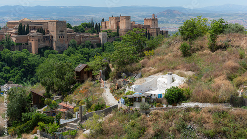 Vista de algunas casa cueva del Sacromonte y la Alhambra de Granada photo