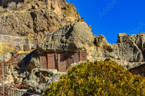 engraved khachkars on the walls of cave church in Geghard Monastery Complex (Kotayk province, Armenia) photo