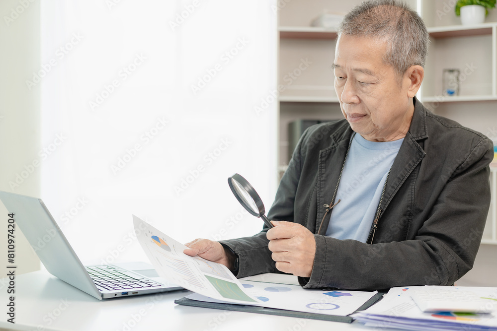 Financial data analysis, senior Asian businessman working with documents in office, having a meeting, video calling, management, technology for modern business remotely. Financial data analysis, senior Asian businessman working with documents in office, having a meeting, video calling, management, technology for modern business remotely.