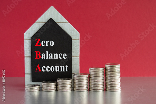 ZBA zero balance account symbol. Concept words ZBA zero balance account on beautiful black house blackboard. Beautiful red background. Business ZBA zero balance account concept.