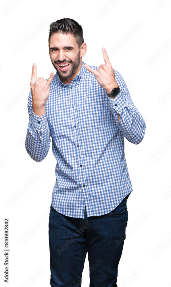 Young handsome man over isolated background shouting with crazy expression doing rock symbol with hands up. Music star. Heavy concept. Young handsome man over isolated background shouting with crazy expression doing rock symbol with hands up. Music star. Heavy concept.