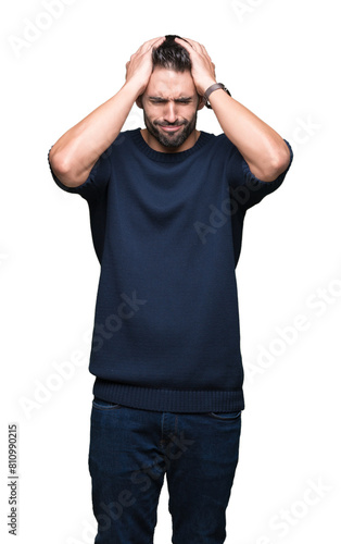 Fotografie Young handsome man wearing sweater over isolated background suffering from headache desperate and stressed because pain and migraine