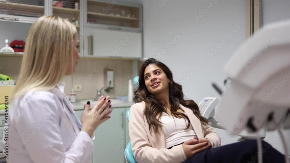 Cheerful woman cooperating with her dentist Cheerful woman cooperating with her dentist