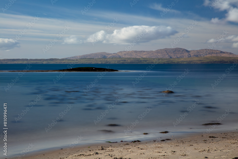 Sunny afternoon looking across Ganavan Bay with the Isle of Mull in the distance. Oban, Argyll and Bute, Scotland. Sunny afternoon looking across Ganavan Bay with the Isle of Mull in the distance. Oban, Argyll and Bute, Scotland.