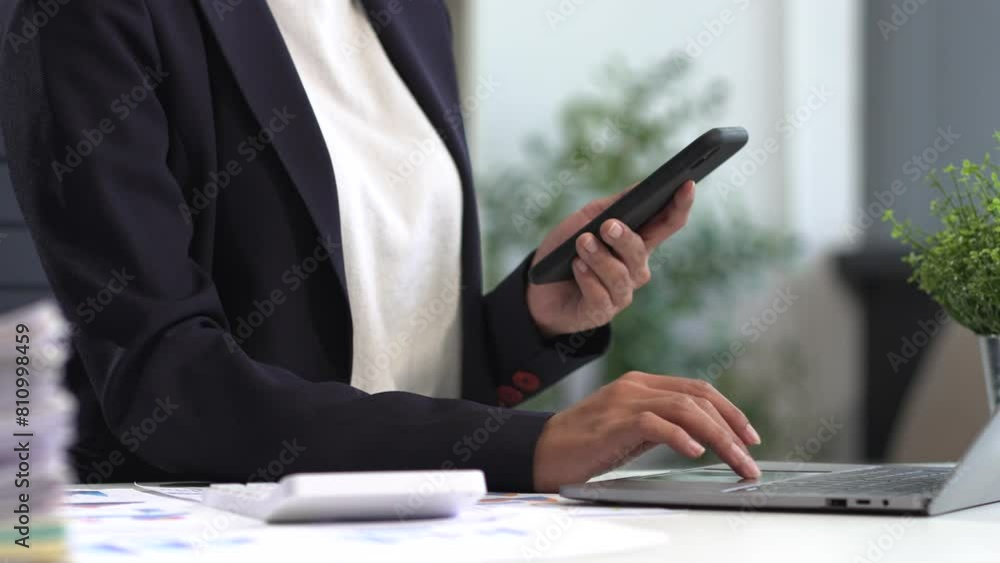 Businesswomen working with tablet and using a calculator to calculate the tax of static in office. Finance accounting concept. Businesswomen working with tablet and using a calculator to calculate the tax of static in office. Finance accounting concept.