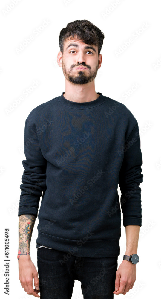 Fototapeta premium Young handsome man over isolated background puffing cheeks with funny face. Mouth inflated with air, crazy expression.