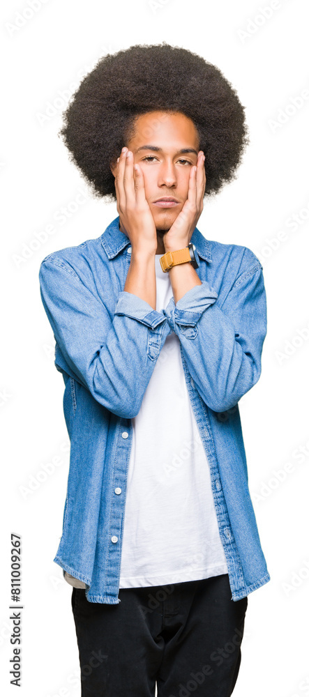 Young african american man with afro hair Tired hands covering face, depression and sadness, upset and irritated for problem Young african american man with afro hair Tired hands covering face, depression and sadness, upset and irritated for problem