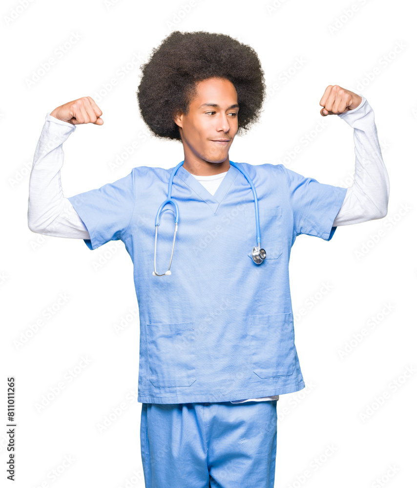 Young african american doctor man with afro hair showing arms muscles smiling proud. Fitness concept. Young african american doctor man with afro hair showing arms muscles smiling proud. Fitness concept.