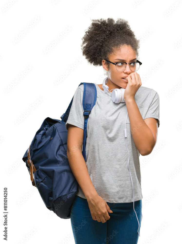 Young afro american student woman wearing headphones and backpack over isolated background looking stressed and nervous with hands on mouth biting nails. Anxiety problem. Young afro american student woman wearing headphones and backpack over isolated background looking stressed and nervous with hands on mouth biting nails. Anxiety problem.