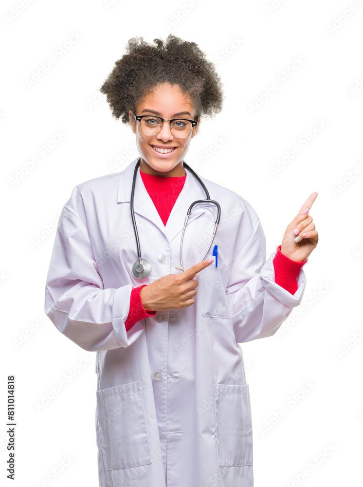 Young afro american doctor woman over isolated background smiling and looking at the camera pointing with two hands and fingers to the side. Young afro american doctor woman over isolated background smiling and looking at the camera pointing with two hands and fingers to the side.