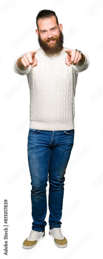 Young hipster man wearing winter sweater Pointing to you and the camera with fingers, smiling positive and cheerful Young hipster man wearing winter sweater Pointing to you and the camera with fingers, smiling positive and cheerful