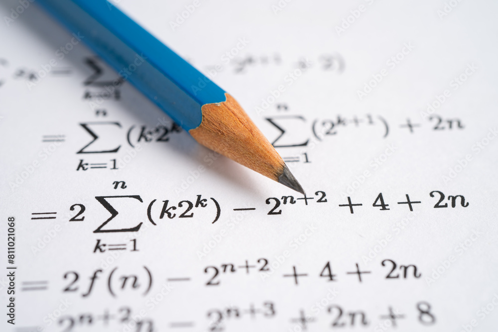 Pencil on mathematic formula exercise test paper in education school. Pencil on mathematic formula exercise test paper in education school.