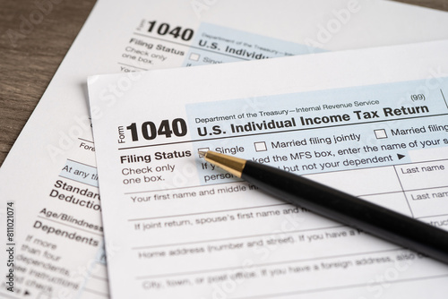 Tax Return form 1040 with pen  U.S. Individual Income.