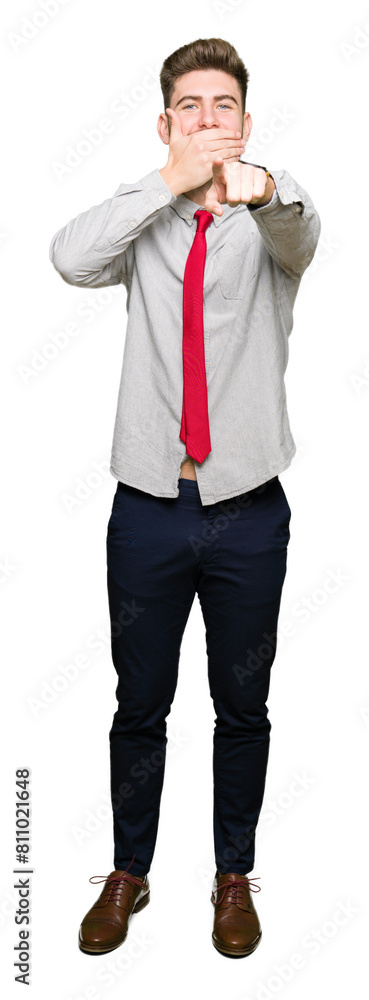 Young handsome business man Laughing of you, pointing to the camera with finger hand over mouth, shame expression Young handsome business man Laughing of you, pointing to the camera with finger hand over mouth, shame expression