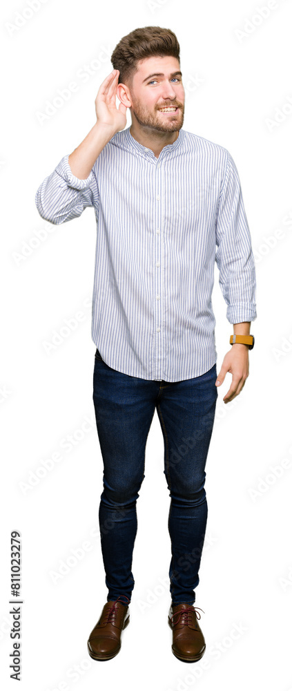 Young handsome man smiling with hand over ear listening an hearing to rumor or gossip. Deafness concept. Young handsome man smiling with hand over ear listening an hearing to rumor or gossip. Deafness concept.