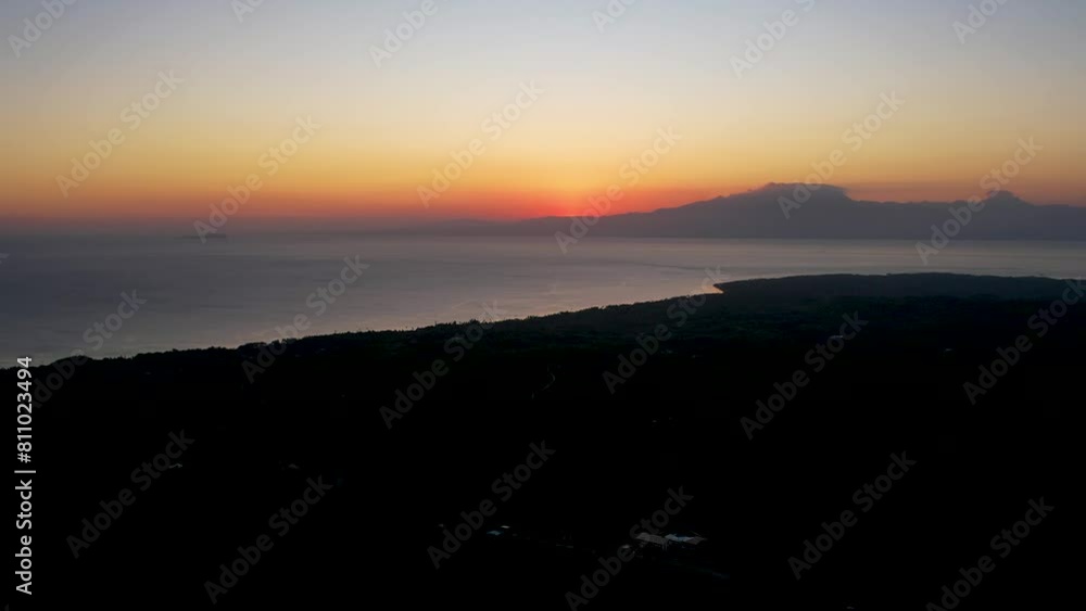 4K Aerial Drone video of the coast of Siquijor island at golden hour with lush jungle and palm trees overlooking the horizon, Philippines 4K Aerial Drone video of the coast of Siquijor island at golden hour with lush jungle and palm trees overlooking the horizon, Philippines