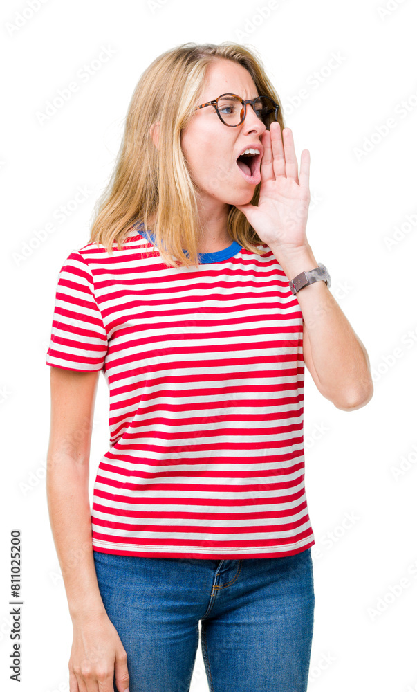 Beautiful young woman wearing glasses over isolated background shouting and screaming loud to side with hand on mouth. Communication concept. Beautiful young woman wearing glasses over isolated background shouting and screaming loud to side with hand on mouth. Communication concept.