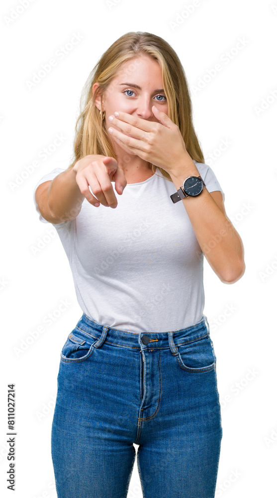 Beautiful young woman wearing casual white t-shirt over isolated background Laughing of you, pointing to the camera with finger hand over mouth, shame expression Beautiful young woman wearing casual white t-shirt over isolated background Laughing of you, pointing to the camera with finger hand over mouth, shame expression