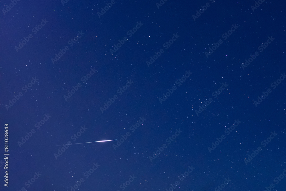 Milky Way stars, meteor falling star trail and night sky photographed with wide angle lens. Milky Way stars, meteor falling star trail and night sky photographed with wide angle lens.
