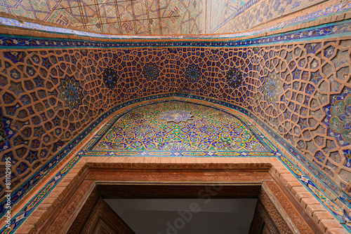 Gate of the Ulugh Beg Madrasah on the Registan Square in Samarkand, Uzbekistan photo