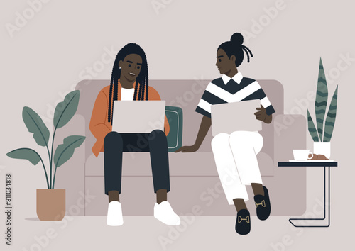Casual Work Chat, Colleagues Collaborating on a Sofa in Modern Office, Two professionals engaged in a relaxed discussion with laptops on a comfortable couch