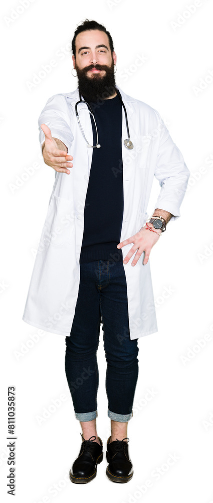 Doctor with long hair wearing medical coat and stethoscope smiling friendly offering handshake as greeting and welcoming. Successful business. Doctor with long hair wearing medical coat and stethoscope smiling friendly offering handshake as greeting and welcoming. Successful business.