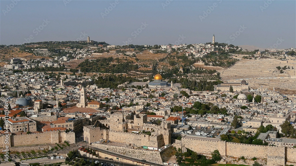 Jerusalem old city aerial view with the holy places at noon
Drone view from east Jerusalem old city and golden dome of the rock, may 2022 at noon, israel

