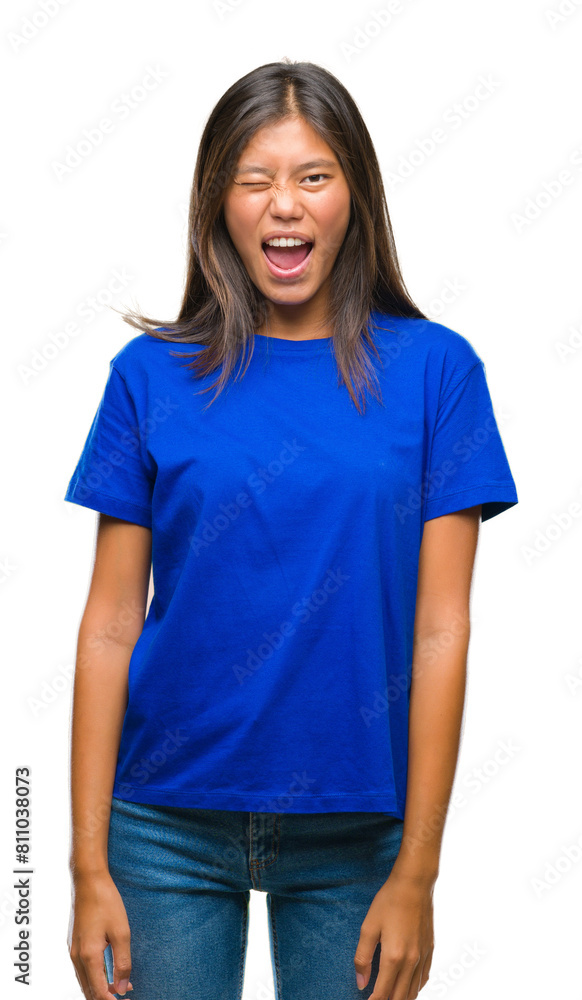 Young asian woman over isolated background winking looking at the camera with sexy expression, cheerful and happy face. Young asian woman over isolated background winking looking at the camera with sexy expression, cheerful and happy face.
