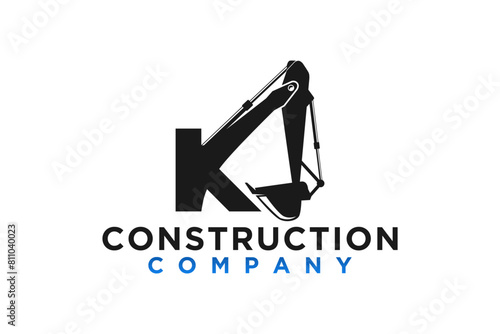 Logo design of an excavator at a construction site with the initials letters K, Heavy equipment work earth mover.
