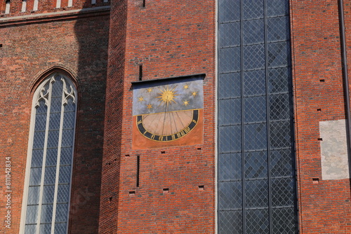 A sundial on the Ghotic wall #811042834