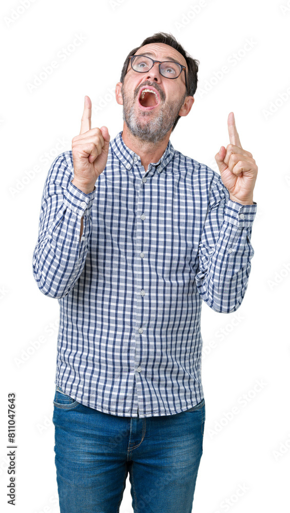 Handsome middle age elegant senior business man wearing glasses over isolated background amazed and surprised looking up and pointing with fingers and raised arms. Handsome middle age elegant senior business man wearing glasses over isolated background amazed and surprised looking up and pointing with fingers and raised arms.