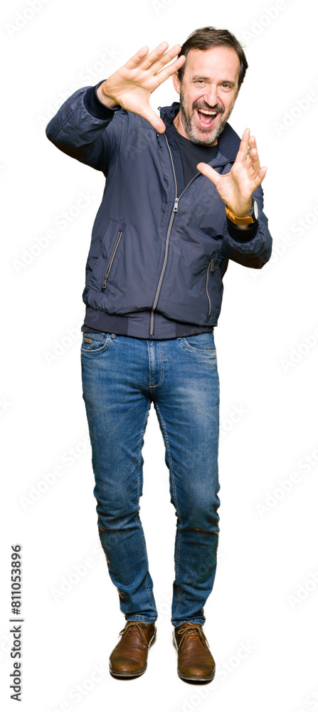 Middle age handsome man wearing a jacket Smiling doing frame using hands palms and fingers, camera perspective Middle age handsome man wearing a jacket Smiling doing frame using hands palms and fingers, camera perspective