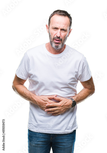 Middle age hoary senior man wearing white t-shirt over isolated background with hand on stomach because indigestion, painful illness feeling unwell. Ache concept.