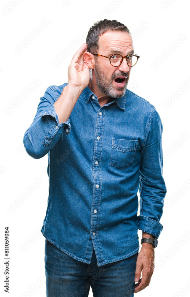 Middle age hoary senior man wearing glasses over isolated background smiling with hand over ear listening an hearing to rumor or gossip. Deafness concept. Middle age hoary senior man wearing glasses over isolated background smiling with hand over ear listening an hearing to rumor or gossip. Deafness concept.
